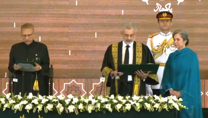 President Dr Arif Alvi administers oath from Justice Qazi Faez Isa for the chief justice of Pakistan at the President House on September 17, 2023, in this still taken from a video. — YouTube/PTV News Live