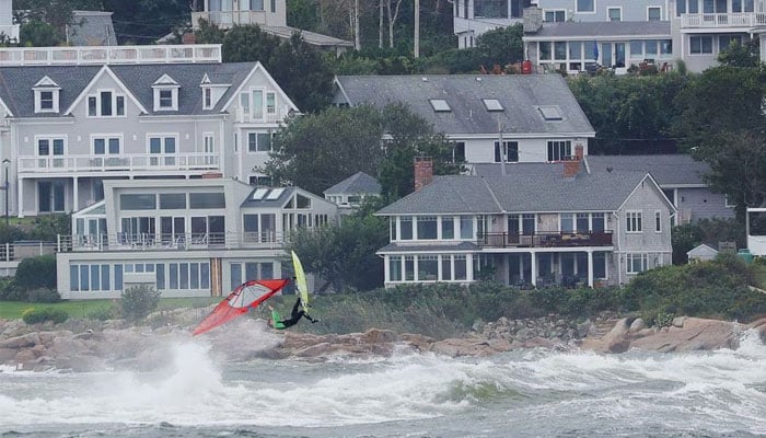 A windsurfer takes advantage of the wind and waves from post-tropical storm Lee, which passed by off shore, in Gloucester, Massachusetts, US, September 16, 2023. — Reuters