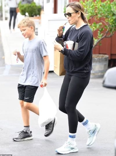 Jennifer Garner gives her son Samuel a piggyback ride after picking him up  from school in Brentwood