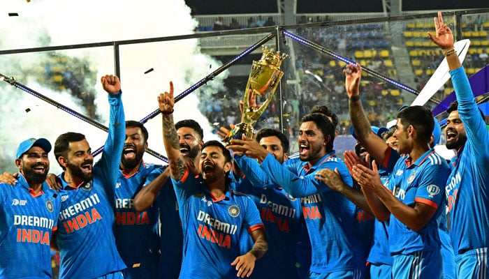 Indian players celebrate with the trophy after winning the Asia Cup 2023 ODI final cricket match between India and Sri Lanka at the R. Premadasa Stadium in Colombo on September 17, 2023. — AFP