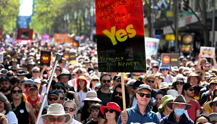 Crowds march during a Walk for Yes rally in Melbourne on September 17, 2023.—AFP