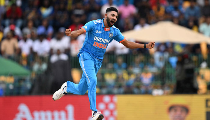 India´s Mohammed Siraj celebrates after taking the wicket of Sri Lanka´s Dhananjaya de Silva during the Asia Cup 2023 final ODI match between Sri Lanka and India at the R. Premadasa Stadium in Colombo on September 17, 2023.— AFP