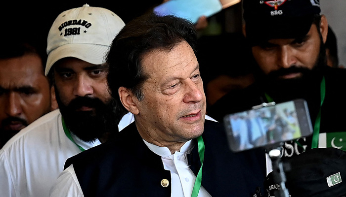 Pakistan Tehreek-e-Insaf (PTI) Chairman Imran Khan leaves after appearing in the Supreme Court in Islamabad on July 26, 2023. — AFP