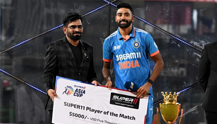 Indias Mohammed Siraj receives the Player of the match award at the end of the Asia Cup 2023 one-day international (ODI) final cricket match between India and Sri Lanka at the R Premadasa Stadium in Colombo on September 17, 2023. — AFP