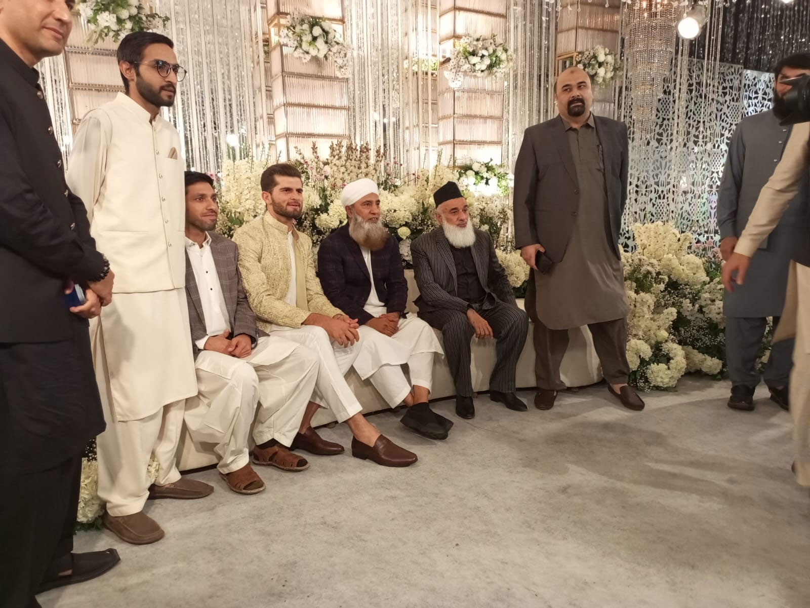 Shaheen Shah Afridi (third left) sits on the stage with guests. — Author
