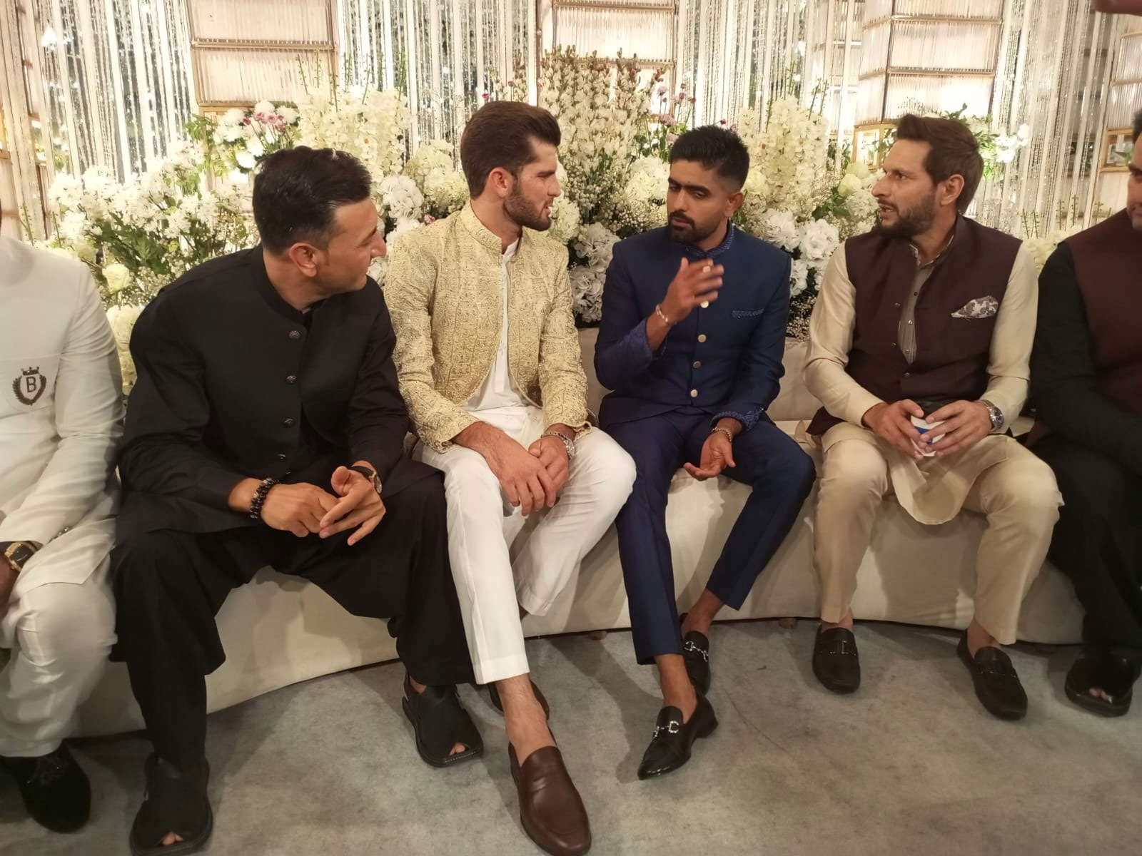 Shaheen Shah Afridi (third left) talks to Babar Azam (centre) and Shahid Afridi (second right). — Author