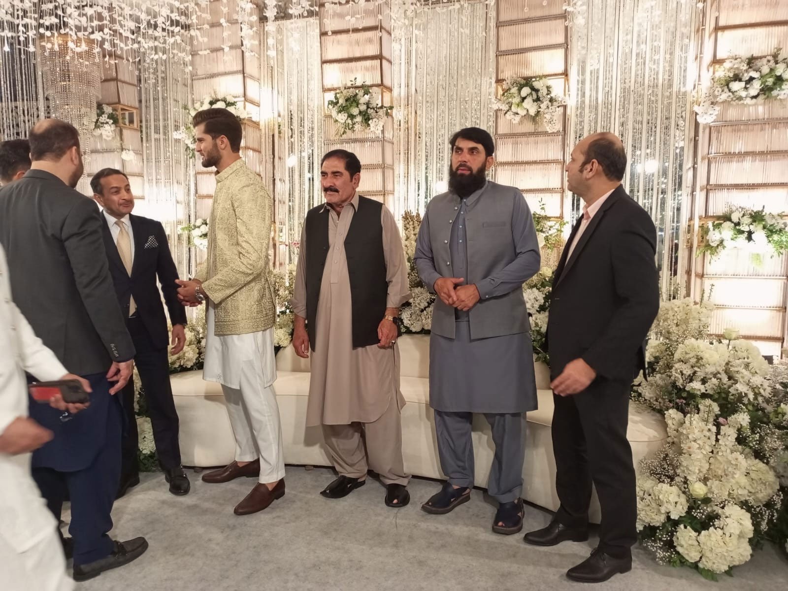Shaheen Shah Afridi (third left) talks to guests. — Author