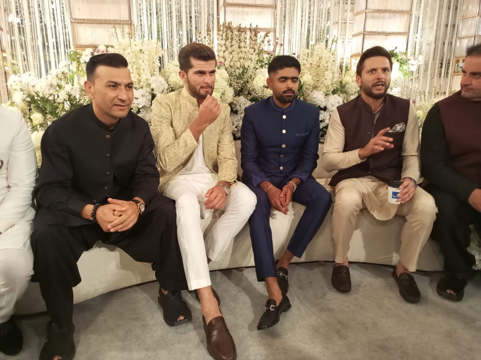 Shaheen Shah Afridi (third left) sits beside Babar Azam (centre) and Shahid Afridi (second right). — Author