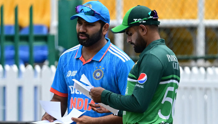 Indias captain Rohit Sharma (L) and Pakistans captain Babar Azam arrive for the toss before the start of the Asia Cup 2023 super four ODI match between India and Pakistan at the R Premadasa Stadium in Colombo on September 10, 2023. — AFP