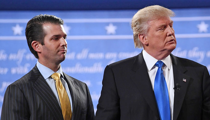 Donald Trump standing with his son Donald Trump Jr. after the first presidential debate at Hofstra University in Hempstead, New York on Sept. 26, 2016. — AFP