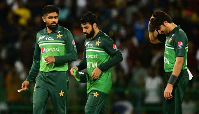 Captain Babar Azam (L) and team mates react as they walk back to the pavilion after Sri Lanka´s victory by 2 wickets after the Asia Cup 2023 Super Four one-day international (ODI) cricket match between Sri Lanka and Pakistan at the R. Premadasa Stadium in Colombo early September 15, 2023. -AFP