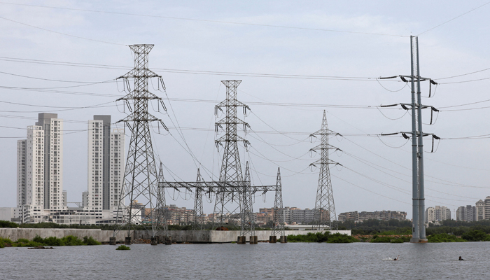 Power transmission towers are pictured in Karachi, July 26, 2022. — Reuters