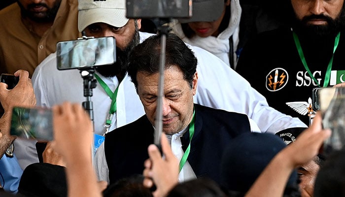 PTI Chairman Imran Khan leaves after appearing in the Supreme Court in Islamabad on July 26, 2023. — AFP
