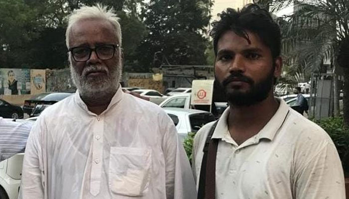 Indian citizens Mohammad Hasnain and Ishaq Amir near the Karachi Press Club. — Reporter