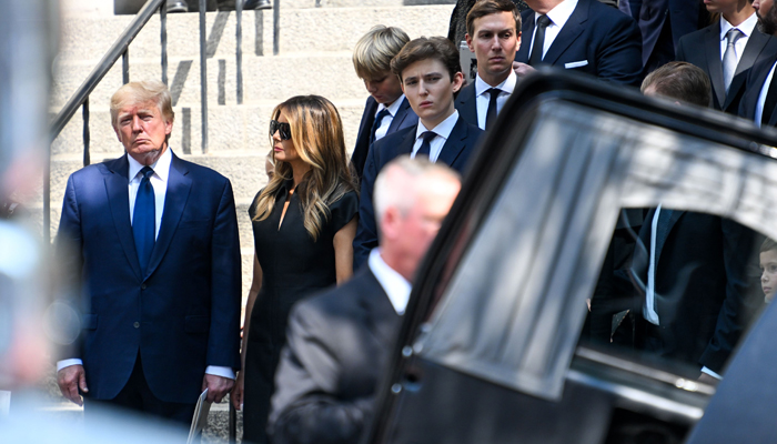 Former President Donald J. Trump, Melania Trump, and Barron Trump exit the funeral of Ivana Trump at St. Vincent Ferrer Roman Catholic Church on July 20, 2022 in New York City. — AFP
