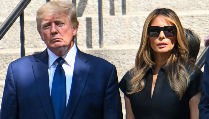 Former President Donald Trump and Melania Trump exit the funeral of Ivana Trump at St. Vincent Ferrer Roman Catholic Church on July 20, 2022, in New York City. — AFP