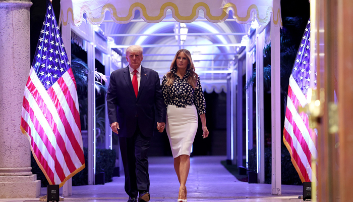 Former President Donald Trump and former first lady Melania Trump arrive for an event at his Mar-a-Lago home on November 15, 2022 in Palm Beach, Florida. — AFP