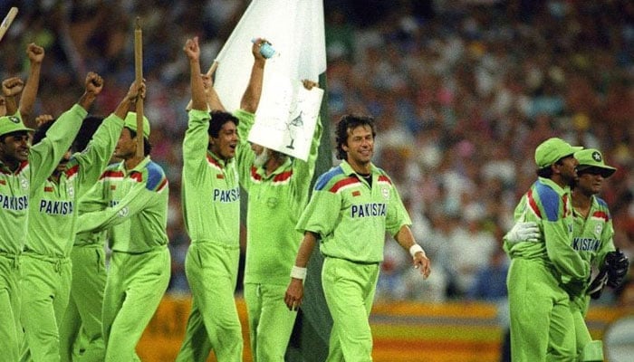 Imran Khan walks with his teammates after winning the World Cup for Pakistan. — ICC/File