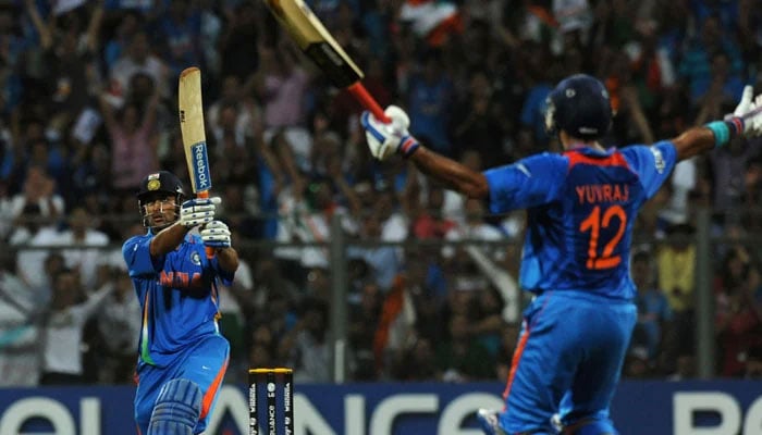 MS Dhoni seals Indias World Cup with a six while Yuvraj Singh celebrates at the non-strikers end. — AFP