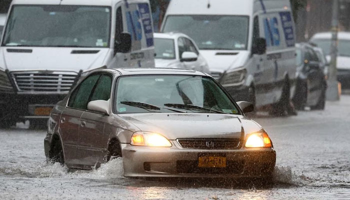 Traffic is seen on a flooded street, as the remnants of Tropical Storm Ophelia bring flooding across mid-Atlantic and Northeast, in the Brooklyn borough of New York City, US, September 29, 2023.—Reuters