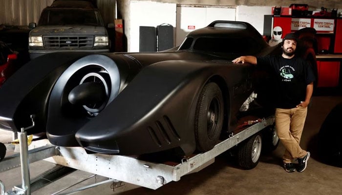 French car collector Franck Galiegue poses near the Batmobile from Six Flags park in California, inside the Pop Central museum dedicated to legendary vehicles and car replicas from the world of cinema and television in Etrechy, near Paris, France, September 17, 2023. — Reuters