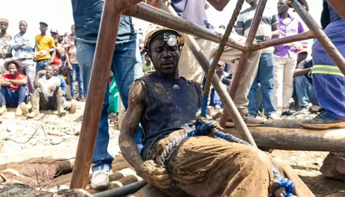 A rescue worker in the middle of the rescue operation after a gold mine collapsed in Zimbabwe in 2019. — AFP/File