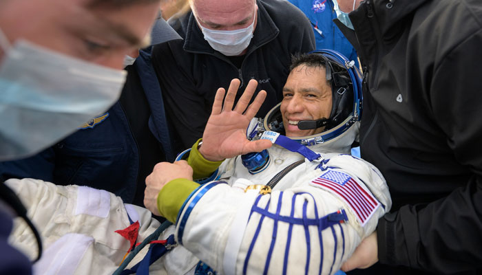 Astronaut Frank Rubio being carried by personnel after returning to earth on September 27, 2023, after more than 355 days on the International Space Station. — X/@NASA