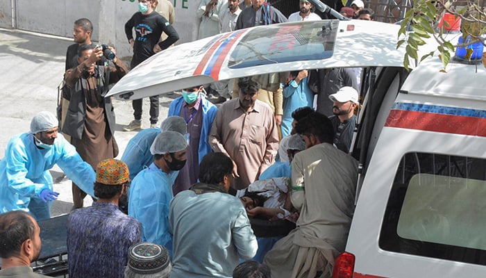 Men and paramedic staff transfer a man, who was injured in a blast in Mastung, from an ambulance outside hospital in Quetta, September 29, 2023. — Reuters