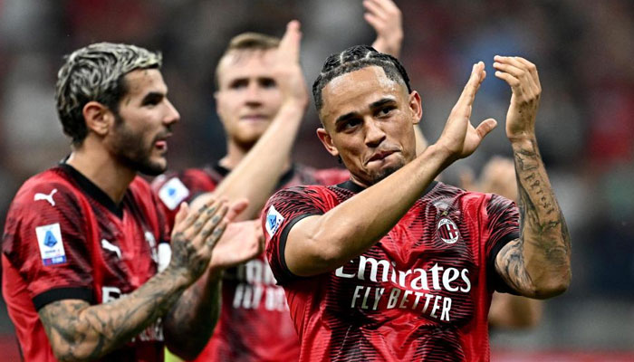 Milan players celebrate their victory over Lazio. AFP