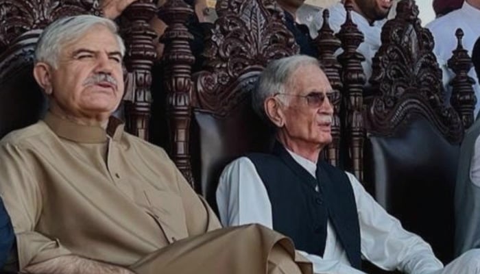 PTIP leader Mahmood Khan (left) and founder Pervez Khattak attend a political gathering in KP. — Twitter/@official_ptip