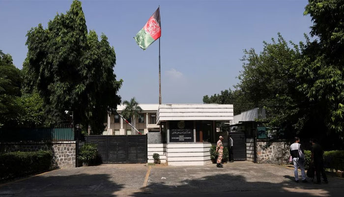 People are seen outside the Afghanistan embassy in New Delhi, India, on September 29, 2023. — Reuters