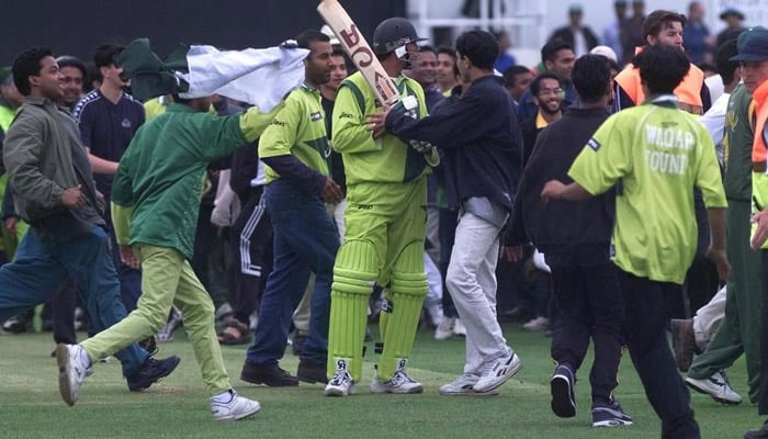 Bangladeshs supporters storm the field after their country beat Pakistan in the 1999 World Cup. — AFP/File