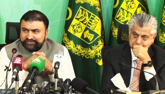 Caretaker Interior Minister Sarfraz Bugti (left) addressing a press conference in Islamabad, on October 2, 2023, in this still taken from a video. — YouTube/PTVNewsLive