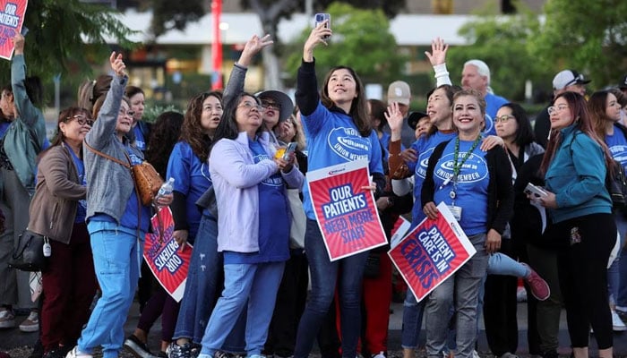 Healthcare workers on strike gather, as a coalition of Kaiser Permanente Unions representing 75,000 healthcare workers at Kaiser Permanente start a three day strike across the United States over a new contract, in San Diego, California, US October 4, 2023.—Reuters