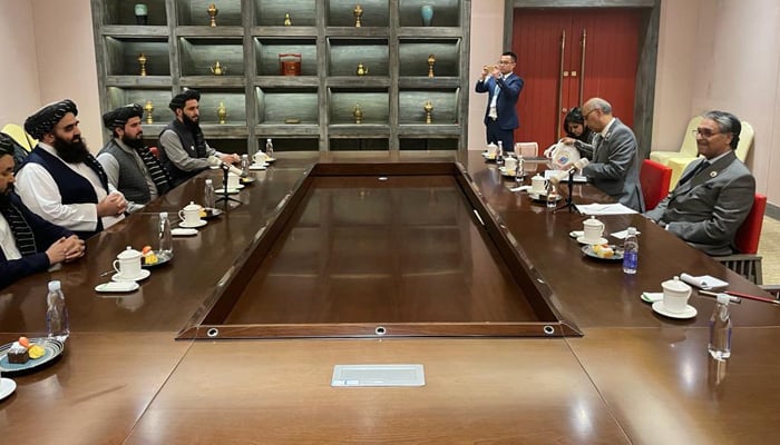 Interim Foreign Minister Jalil Abbas Jilani (left) meets his Afghan counterpart Amir Khan Muttaqi (centre left), in Tibet, China, on October 5, 2023. — X/ForeignOfficePk