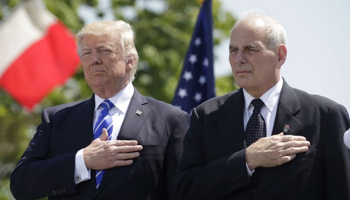 Donald Trump and John Kelly at the Coast Guard Academy commencement ceremonies in New London, Conn., in May 2017. Reuters file