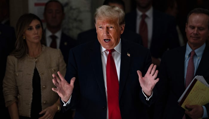 Former President Donald Trump addresses the press during a lunch break on the third day of his civil fraud trial at New York State Supreme Court on October 4, 2023, in New York City. —AFP