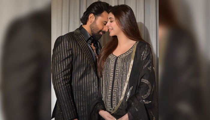 Faran Saeed poses with his wife Urwa Hocane as she shows off her baby bump. — Instagram/@urwatistic