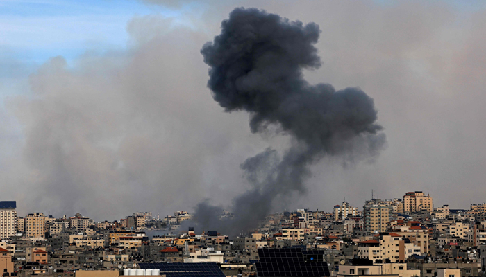 Smoke billows over Gaza City on October 7, 2023, following an Israeli air strike. — AFP