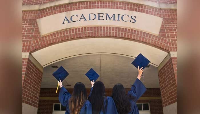 Students pose at their graduation. — Unsplash/File