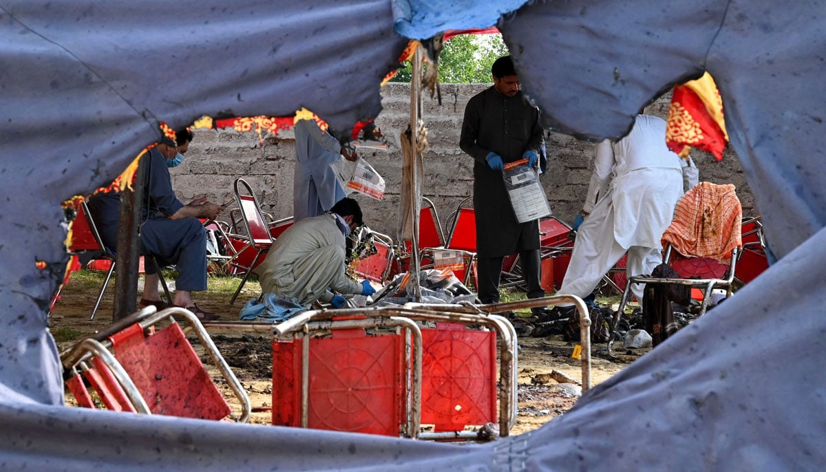 Security personnel stand guard at the site of a bomb blast in Bajaur district of Khyber-Pakhtunkhwa province on July 31, 2023. — AFP