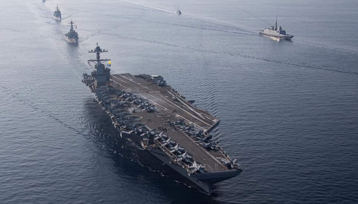 The aircraft carrier Gerald R. Ford, accompanied by warships and destroyers can be seen in this picture released on July 17, 2023. — X/@Warship_78