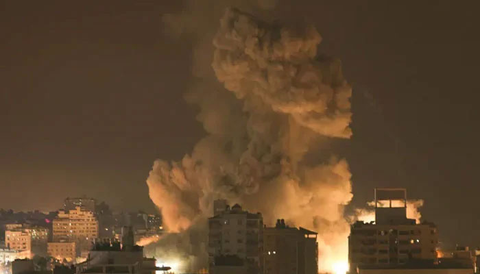 A plume of smoke rises in the sky of Gaza City during an Israeli airstrike on October 9, 2023. — AFP