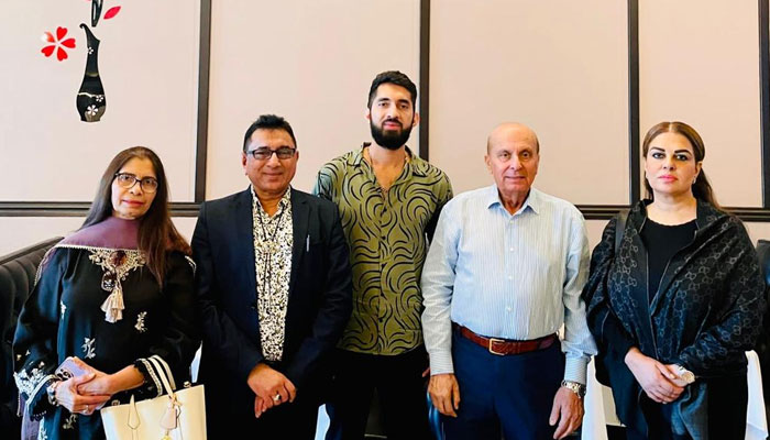 Namira Salim (first right) poses for a group photo with Syed Javaid Anwar (second right). — by reporter