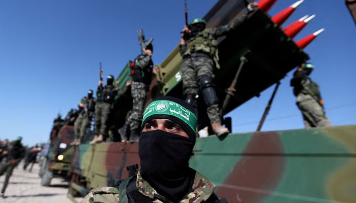 Palestinian resistance group Hamas fighters attend an anti-Israel rally in Khan Younis, in the southern Gaza Strip May 27, 2021. — Reuters