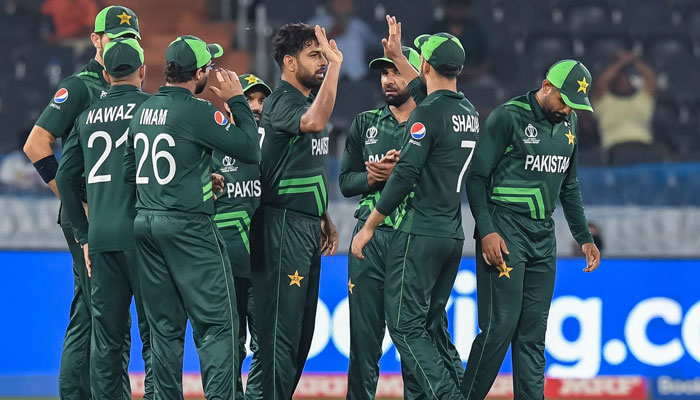 Pakistans Haris Rauf celebrates with teammates after taking the wicket of Netherlands captain Scott Edwards during the 2023 ICC Men´s Cricket World Cup at the Rajiv Gandhi International Stadium in Hyderabad on October 6, 2023. — AFP