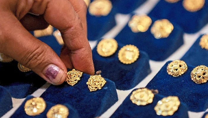 The picture shows gold earrings. — Reuters/File