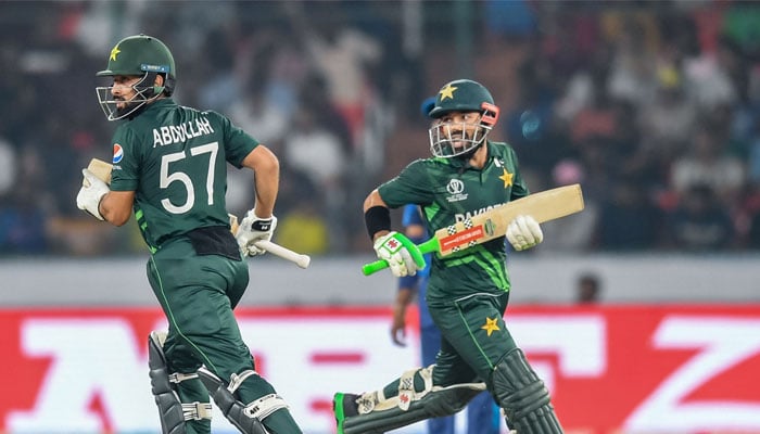 Pakistan´s Mohammad Rizwan (right) and Abdullah Shafique run between the wickets during the 2023 ICC Men´s Cricket World Cup ODI match between Pakistan and Sri Lanka at the Rajiv Gandhi International Stadium in Hyderabad on October 10, 2023.