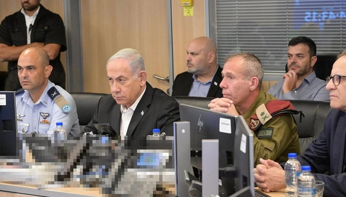 Prime Minister Benjamin Netanyahu (centre-front) in the control cells of the Air Force headquarters in Kirya, with Commander of the Air Force Colonel Tomer Bar (left) on October 9, 2023. — Instagram/@IsraeliPM
