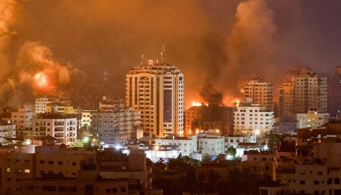 Flames and smoke billow during Israeli strikes in Gaza, October 9. —Reuters